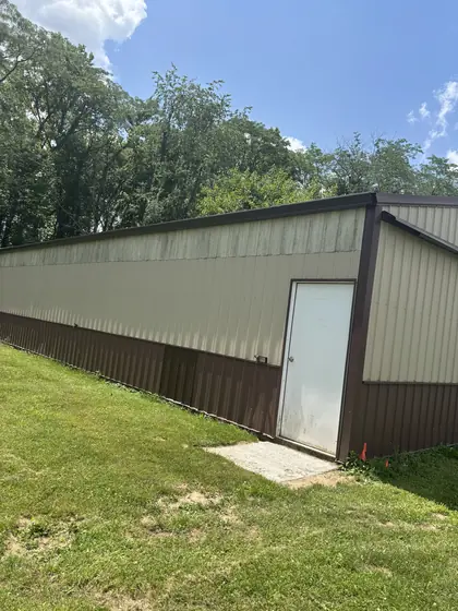 Long seamless gutter run along a metal pole barn