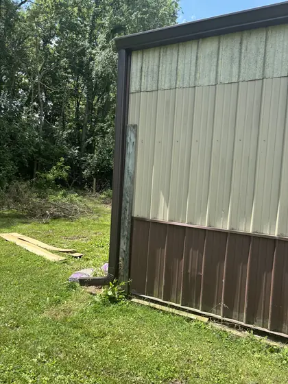 Side elevation of a barn with new guttering